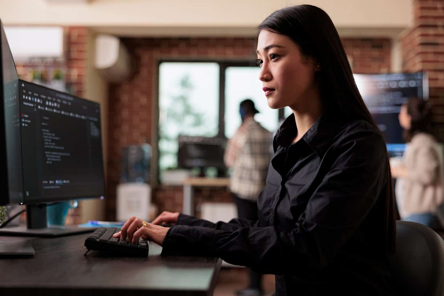 A cybersecurity officer at work in implementing enterprise cloud security standards in Malaysia.