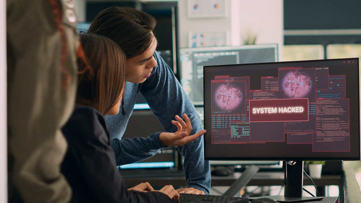 A cybersecurity team in Malaysia performing real-time cloud threat detection at work.