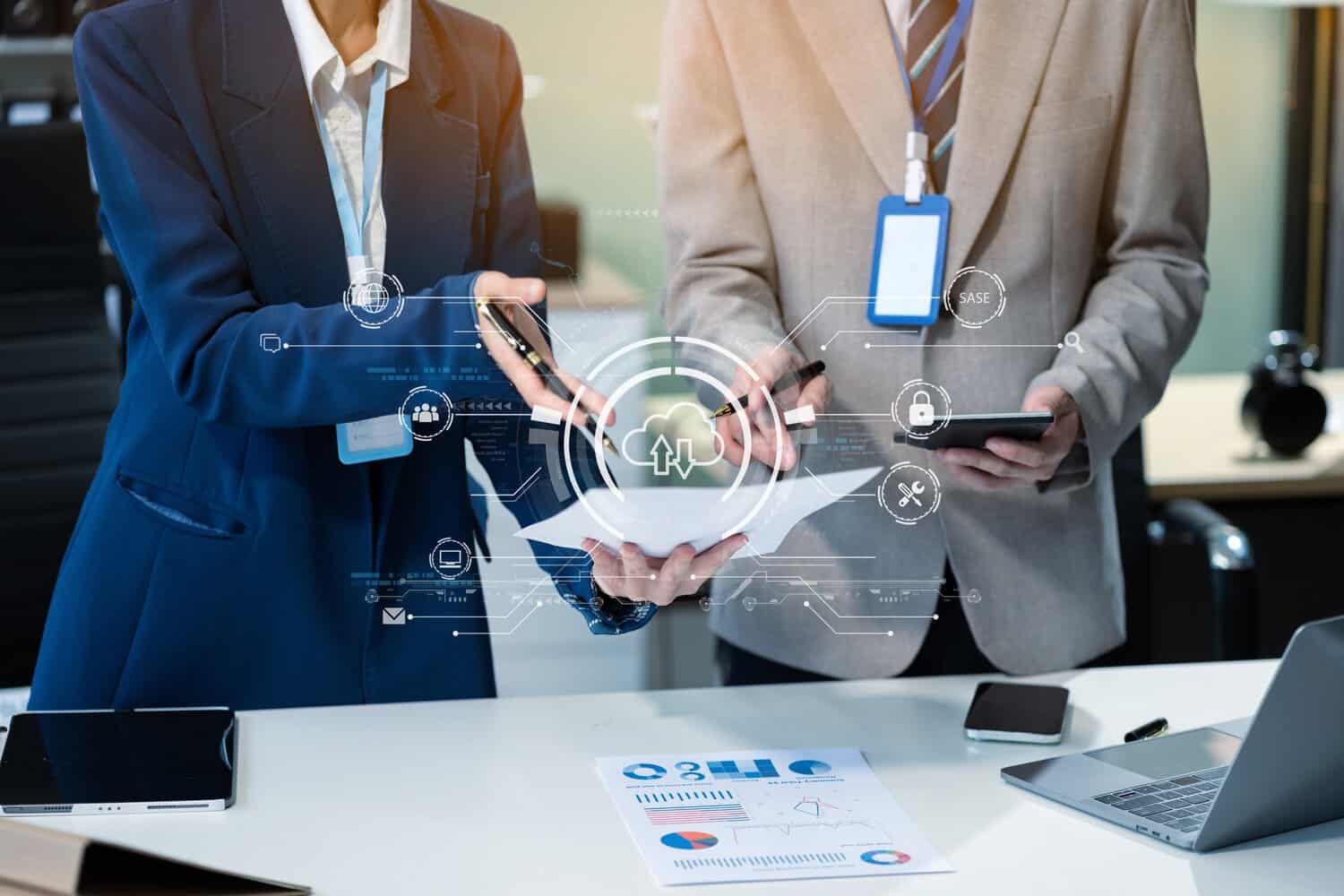 Stylised shot of businesspeople discussing enterprise endpoint vs network security strategies.