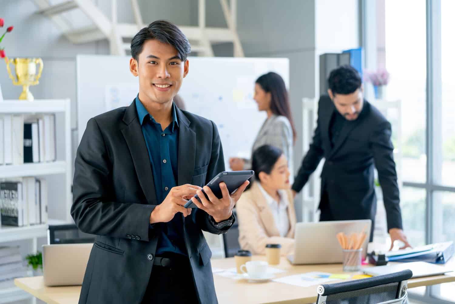 An Asian businessman and his team working out a cloud BCP for his retail chains in Malaysia.