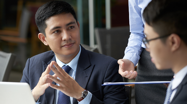 Two CTOs discussing Malaysia cloud solutions for businesses