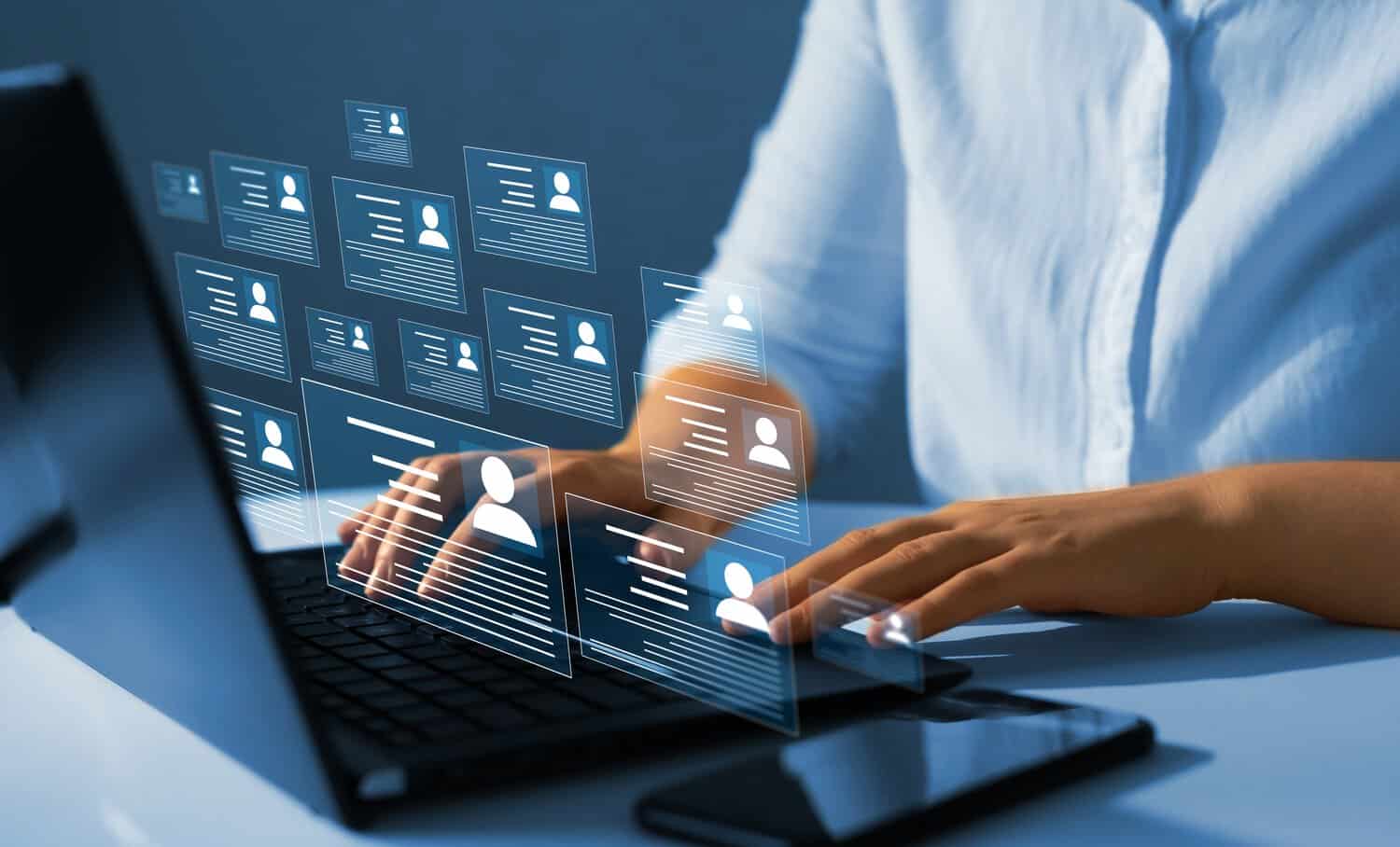A cybersecurity analyst reviewing a managed SOC incident response report, with active threat data displayed across dashboards.
