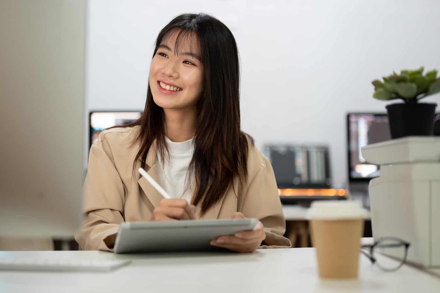 A professional in Malaysia reviewing what to do after a data breach on a monitored security dashboard.